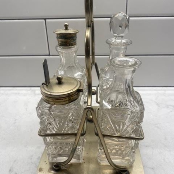 An antique Victorian silverplate and cut glass condiment caddy set